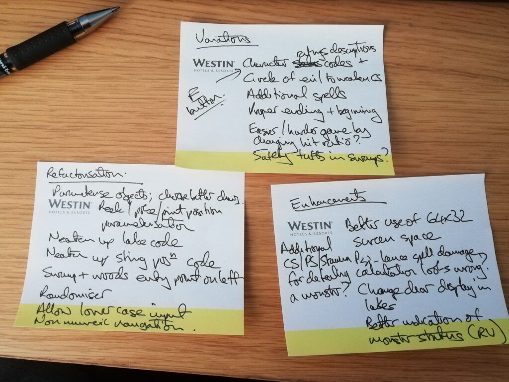 A desk and pen plus three sticky notes labelled variations, refactorisation and enhancements.